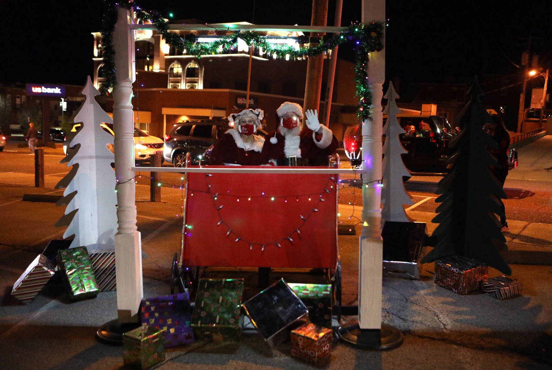 Mrs. Claus and Santa wave
